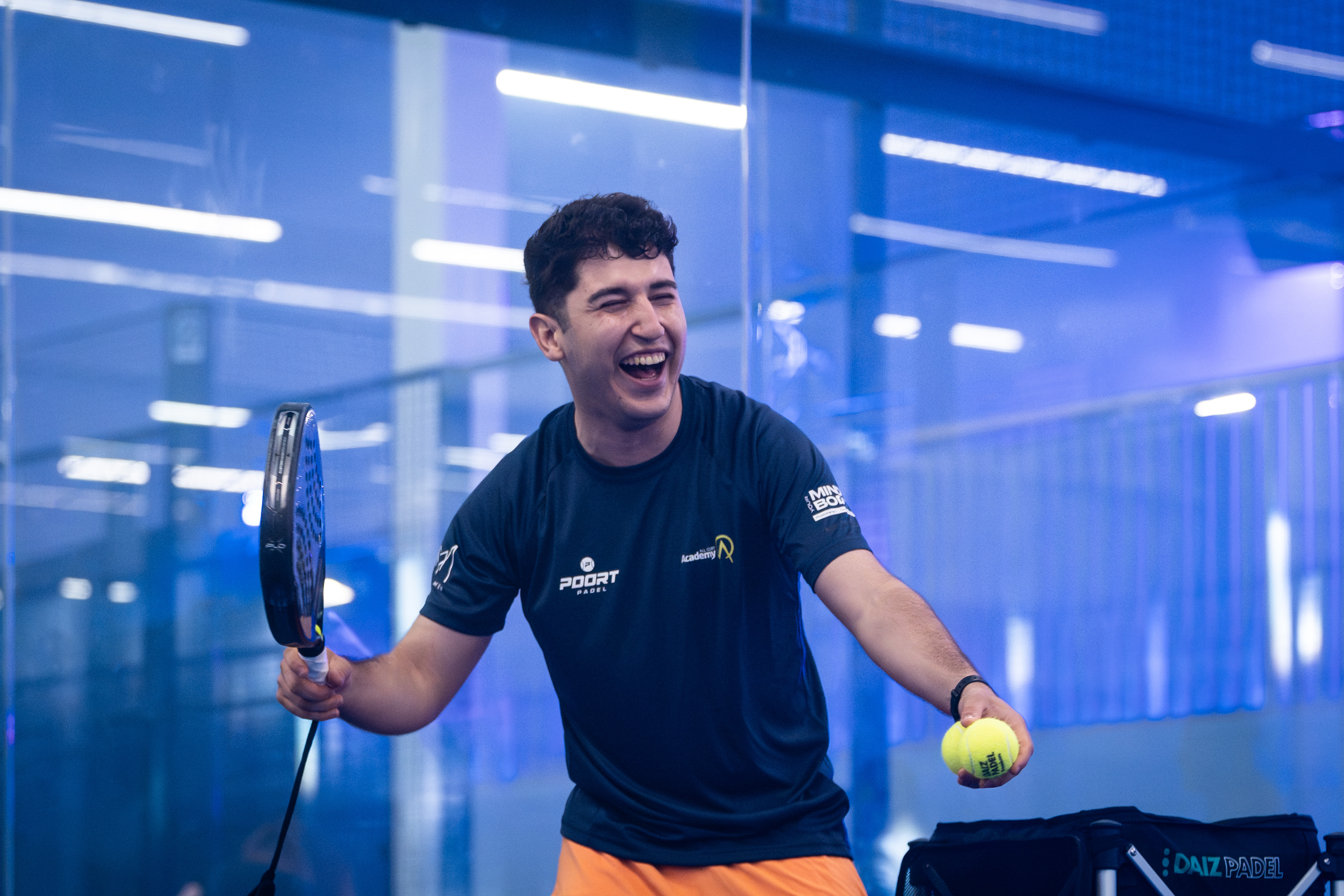 RG Academia padel coach celebrating on court